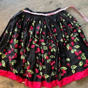 Pinup couture Jenny skirt black with red cherries.